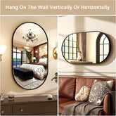 black metal frame round mirror